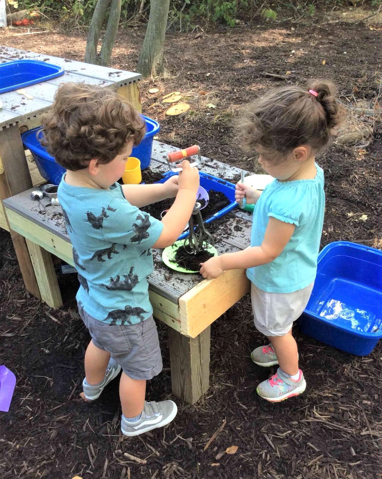 children working in the mud kitchen.jpg